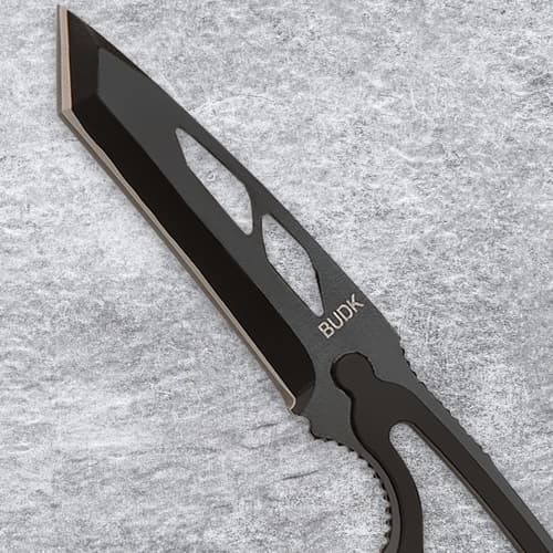 Close-up of a black knife blade with openwork design