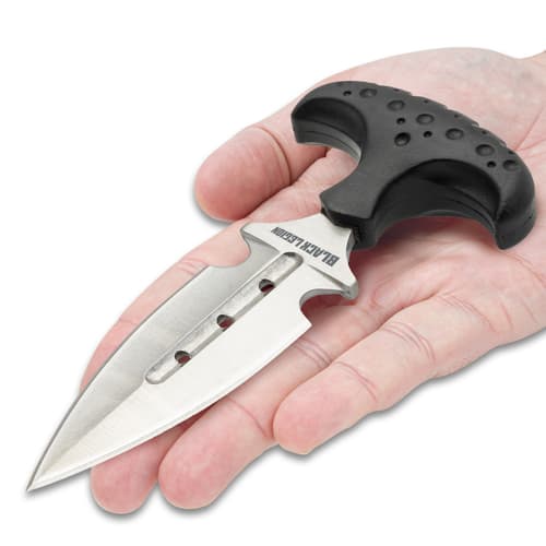 Push dagger laying on hand showing size