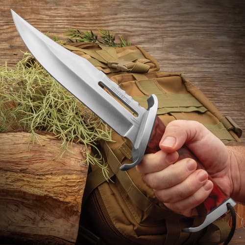 Gil Hibben 3 Knife Rambo Knife held firm grip.Long blade and sleek polished finish,  featuring a prominent fuller groove. A partially serrated spine.Double-edged guard.