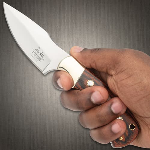 The handle scales are a rich, reddish brown pakkawood, accented with detailed mosaic pins and secured with nickel silver pins