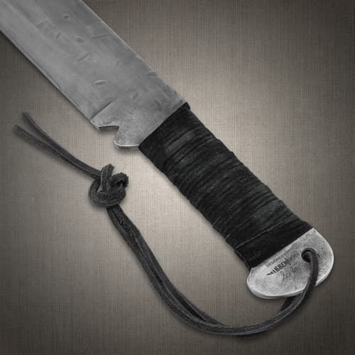 Close-up of machete handle with wrapped grip