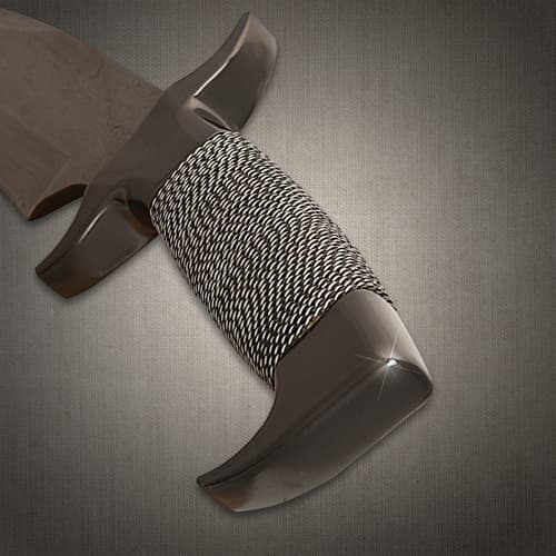 Close-up of knife handle wrapped in steel wire