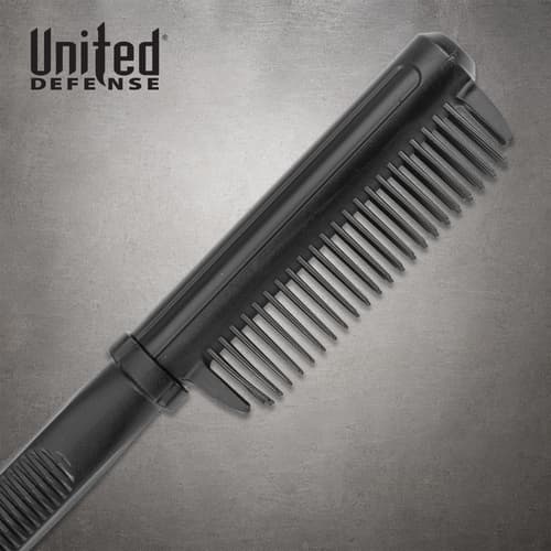 Close-up of the black Dapper Defender brush cover, showing its rows of teeth and connection to the handle