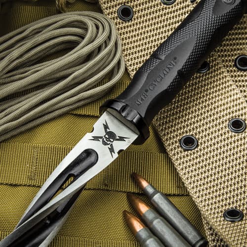 Detailed view of the M48 logo on the knife’s spiraling blade just beneath the textured handle.