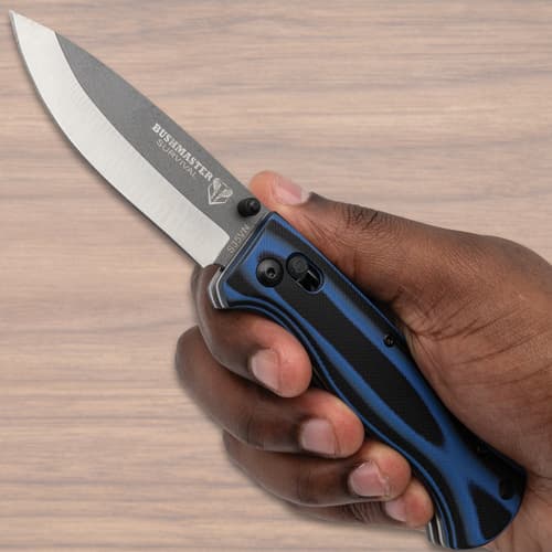 Bushmaster Blue Micarta Pocket Knife in hand