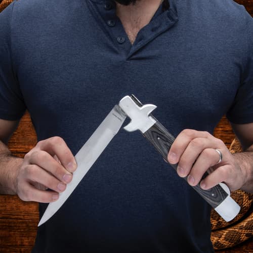 Person holding open Timber Rattler knife with wooden handle