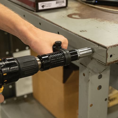 The rivet gun adapter shown in use