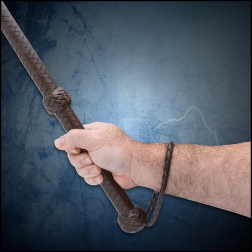The Night Watchman Leather Sjambok shown in hand