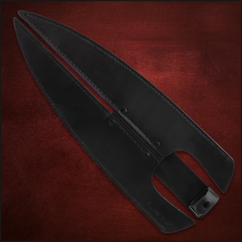 Black leather sheath for double-headed spear on red background