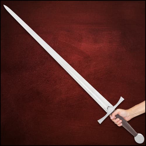 Person holding a medieval sword against a red background