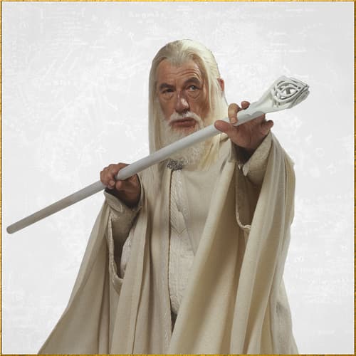 Gandalf in white robes holding a detailed staff