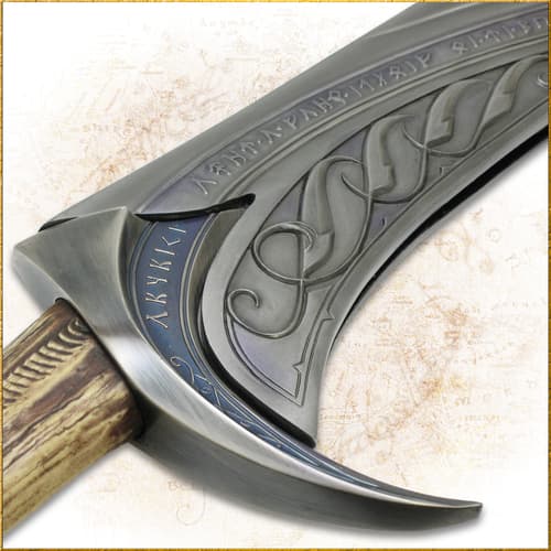 Detailed view of sword hilt with runic inscriptions and wood handle