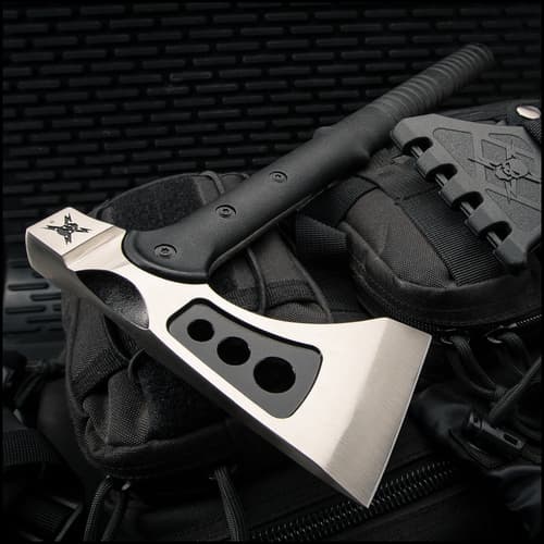 Axe on black tactical gear background