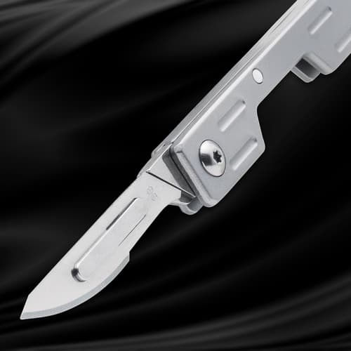 Silver folding knife with partially open blade