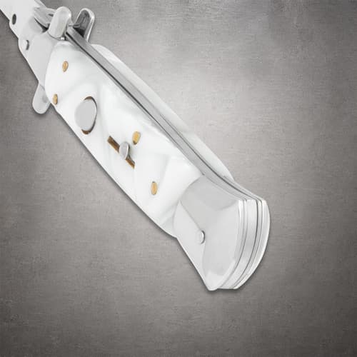Close-up of white pearl stiletto knife handle