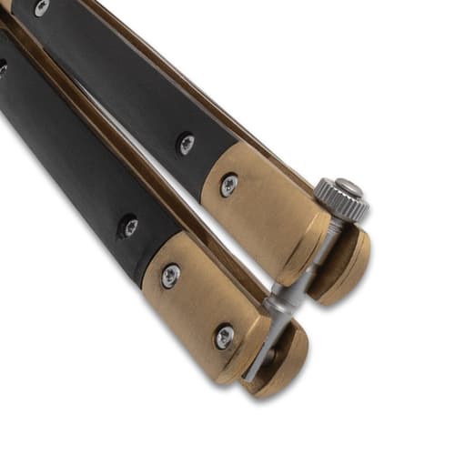 Close-up of the latch on a butterfly knife handle