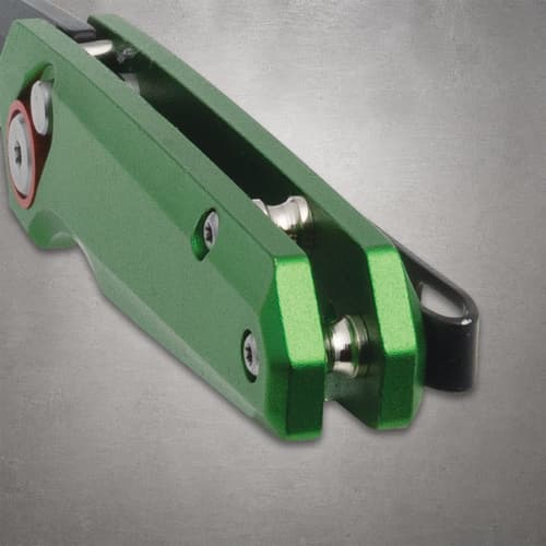 Close-up of green knife handle with pocket clip