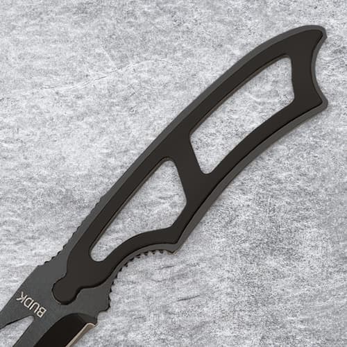 Close-up of a black knife handle with openwork design