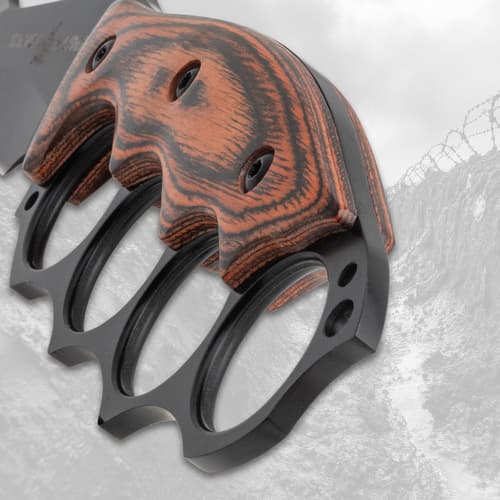 Close-up of wooden handle with knuckle duster design