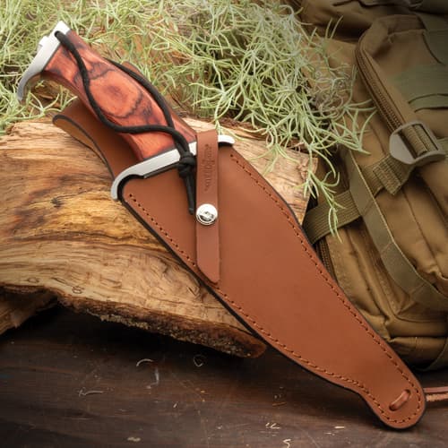 Gil Hibben 3 Knife Rambo Knife tan leather case genuine leather sheath for secure storage sheath, featuring high-quality stitching.Lanyard attached near handle of knife