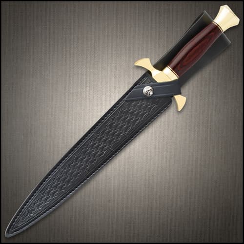 Dagger sheathed in a black leather belt sheath