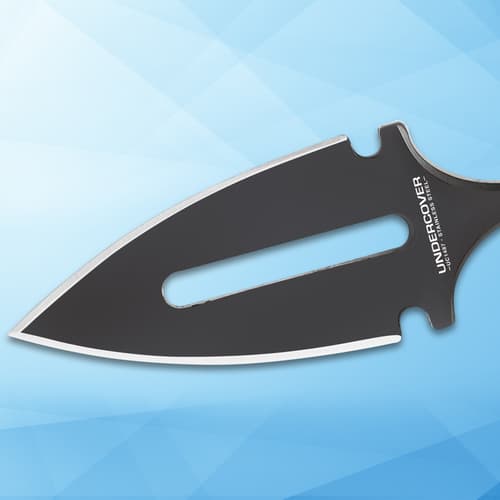 Close-up of black dagger blade on blue background