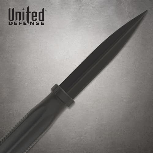 Close-up of the Dapper Defender's exposed black dagger blade, central ridge, guard and partial handle