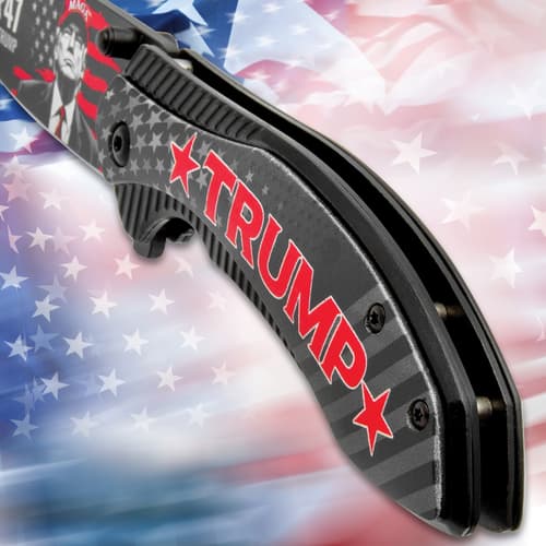 Close-up of knife handle with Trump text and star design