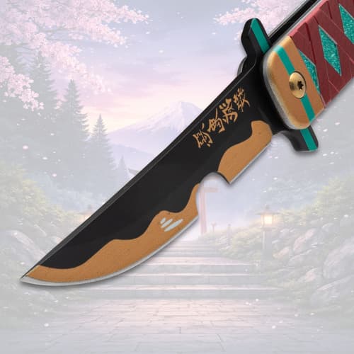 Close-up of knife blade with gold accents and inscriptions