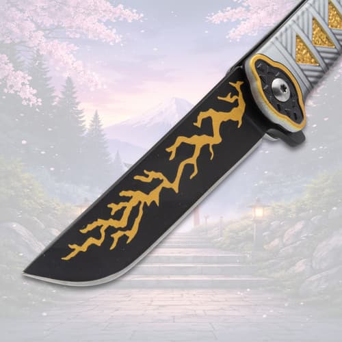 Close-up of knife blade with yellow lightning pattern