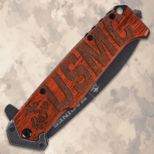 Closed knife showing USMC engraving on handle
