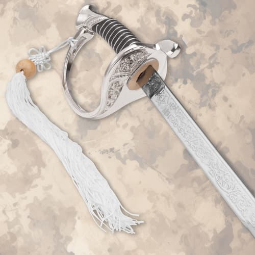 Detailed view of sword hilt with tassel and engraved blade