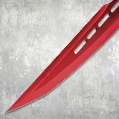 Close-up of the pointed tip of a red sword blade