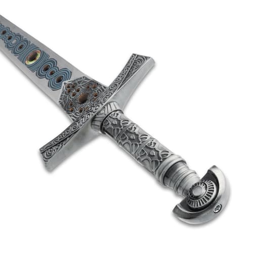 Close-up of sword hilt with detailed engravings