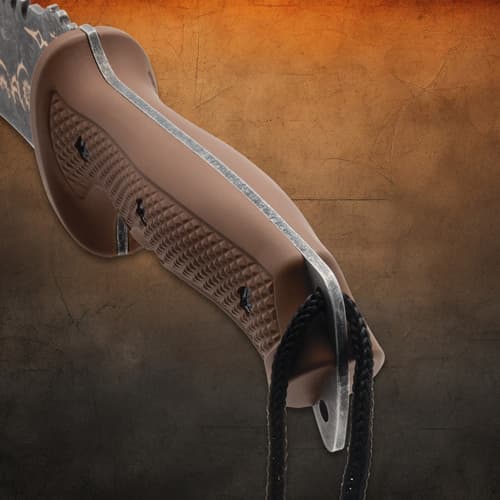 Close-up of machete's textured brown handle