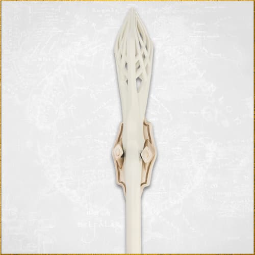 Detailed view of the ornate top of a white staff
