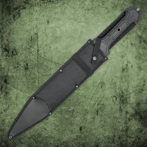 A hand holding the tpr rubberized handle of United Cutlery Combat Commander gladiator 1060 stainless steel sword with a sharp point