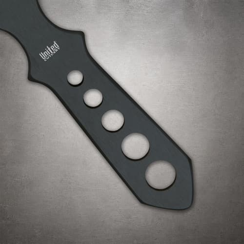 Close-up of the black Lightning Bolt knife handle with five graduated circular cutouts and a white United Cutlery logo
