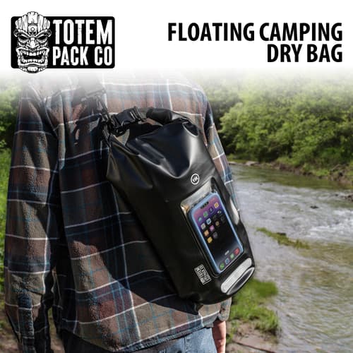 Person carrying a Totem Pack Co floating camping dry bag