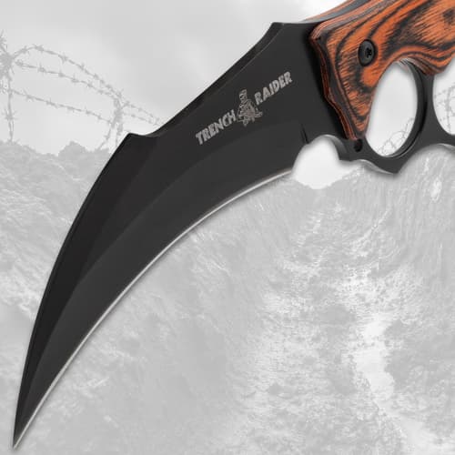 Close-up of curved blade with 'Trench Raider' engraving