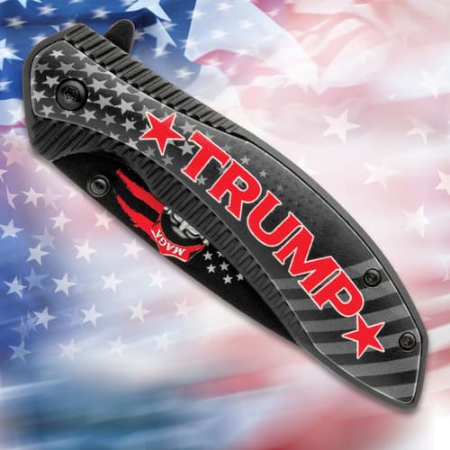 Folded pocket knife with Trump design on American flag background