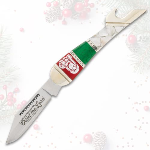 Full view of Christmas-themed knife with engraved blade