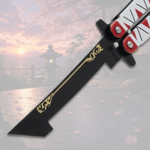 Close-up of butterfly knife blade with gold design