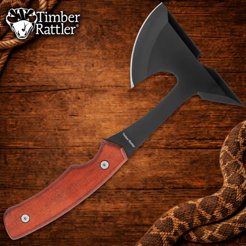 Black axe with wooden handle on wooden background
