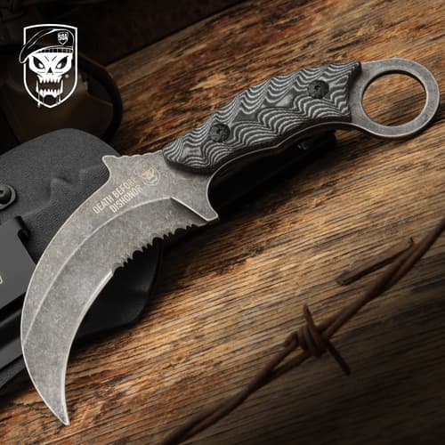 Curved knife with textured handle on wooden surface