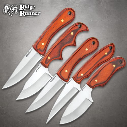 Five knives from the Ridge Runner Wooden Knife Set with brown pakkawood handles, displayed on a gray background