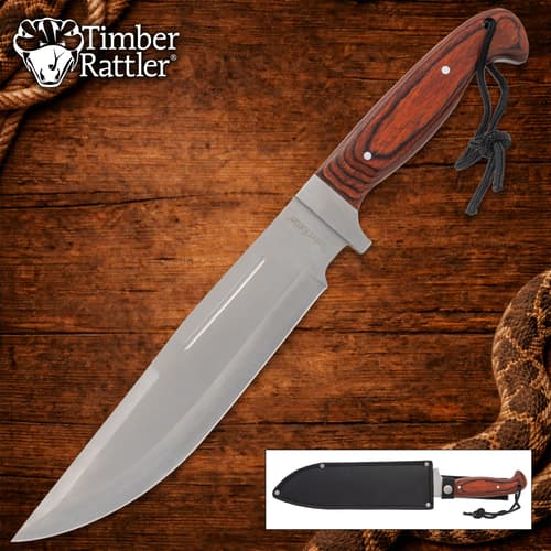 Large knife with wooden handle on wooden background