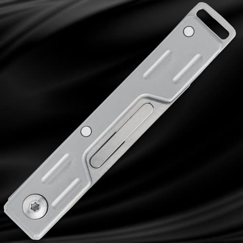 Closed silver folding knife on black background