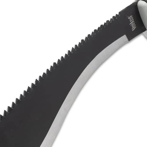 Close-up of serrated edge on black kukri blade