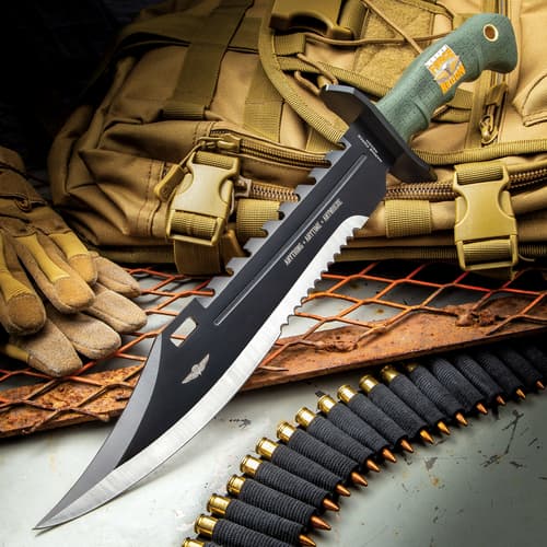 Bowie knife on tactical gear with gloves and ammunition belt